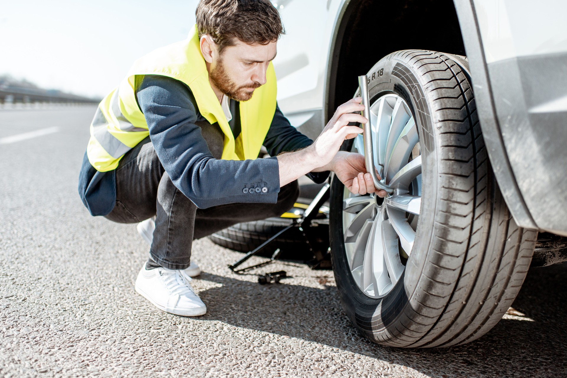 Changing car wheel outdoors